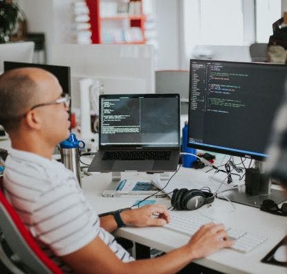 A developer working on a react application at their desk