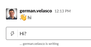 Slack message saying ":wave: hi"